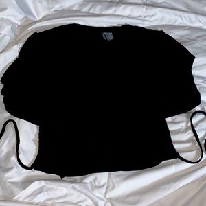 black long sleeve open back shirt